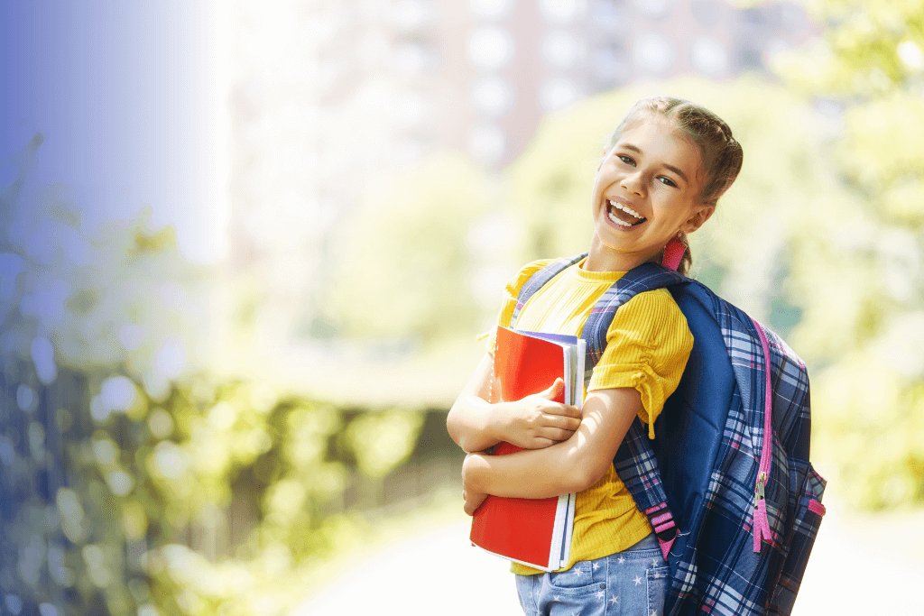 satisfied student with backpack and books